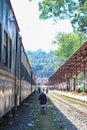 An old man is walking on train platform. Full-length portrait of senior citizen walking on a railway platform after the trip Royalty Free Stock Photo