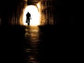 Old Man Walking Through Tunnel Royalty Free Stock Photo