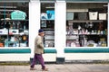 An old man walks alone smoking a pipe Royalty Free Stock Photo