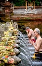 The old man was washed his body at the Bali Holy Spring Water Te Royalty Free Stock Photo