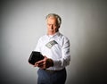 Old man in white and empty wallet. One dollar and taxes. Royalty Free Stock Photo