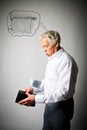 Old man in white and empty wallet. Twenty Euro, heating season, taxes and saving concept. Radiator Royalty Free Stock Photo