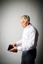 Old man in white and empty wallet. Royalty Free Stock Photo