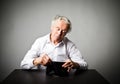 Old man in white and empty wallet. Royalty Free Stock Photo