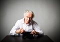 Old man in white and empty wallet. Royalty Free Stock Photo