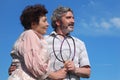 Old man and woman holding badminton rackets Royalty Free Stock Photo