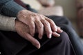 Old man and old woman holding hands Royalty Free Stock Photo