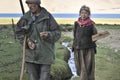 Old man and woman return from the yak pasture to Korzok village