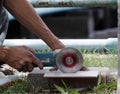 Old man work with dangerous power tool without protection item