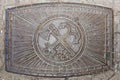 Old manhole cover on the street in Moscow. produced in the USSR Royalty Free Stock Photo