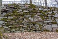 An old manmade stone wall with moss on it Royalty Free Stock Photo