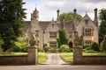 Old Manor House With Decorative Stonework And Tall Spires