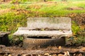 Old marble benches in field