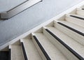 Old marble staircase with the metal rail.