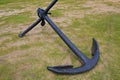 Old marine ship anchor lying on a meadow at the port of Montevideo, Uruguay