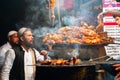 Chicken seekh kababs are being prepared road side