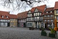 an old market place in Quedlinburg with beautiful hundreds of years old half timbered houses , Germany