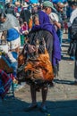 An old market woman selling chicken