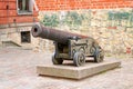 Old massive iron cannon in the Old town of Riga