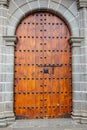 Old Massive Large Wooden Door In A Stone Wall Of A Church