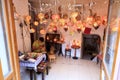 An old master makes traditional oriental lamps from dried pumpkins