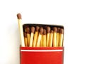 Old matchbox and one matchstick out Royalty Free Stock Photo