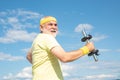 Old mature man exercising with dumbbell. Senior sportsman in sport center. Health club or rehabilitation center for Royalty Free Stock Photo