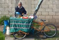 Old mayan man sales juice fruit on the side of the street.