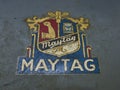 Old Maytag logo on a gas engine that powered a washing machine Royalty Free Stock Photo