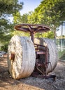 The old mechanism with a stone wheel and a large gear Royalty Free Stock Photo