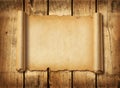 Old mediaeval paper sheet. Horizontal parchment scroll on a wood board Royalty Free Stock Photo