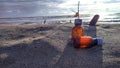 old medicine bottle on the beach under the sunset Royalty Free Stock Photo