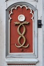 Medicine symbol of old pharmacy. Retro emblem of medicine - two snakes, caduceus, signboard on a wooden door