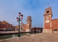 Venice. Old stone towers of the arsenal over the canal on a sunny day. Royalty Free Stock Photo