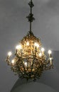 Old medieval chandelier with modern light bulbs