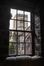 Old medieval churched viewed through pane glass window