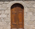 Old Medieval door in a stone wall Royalty Free Stock Photo