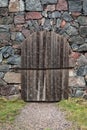 Old medieval door and stone wall texture Royalty Free Stock Photo