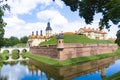 An old medieval fortified castle surrounded by moats filled with water. Residential castle of the Radziwil family in Niasvizh,