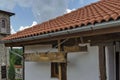 Old medieval house with wooden and iron clapper in restored Montenegrin or Giginski monastery Royalty Free Stock Photo