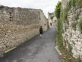 Old medieval houses and man on street in manosque