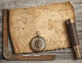 Old medieval island map with compass and spyglass. Adventure and travel concept. 3d illustration. Royalty Free Stock Photo