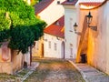 Old medieval narrow cobbled street and small ancient houses of Novy Svet, Hradcany district, Prague, Czech Republic Royalty Free Stock Photo