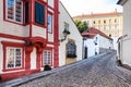 Old medieval narrow cobbled street and small ancient houses of Novy Svet, Hradcany district, Prague, Czech Republic Royalty Free Stock Photo