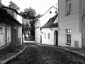 Old medieval narrow cobbled street and small ancient houses of Novy Svet, Hradcany district, Prague, Czech Republic Royalty Free Stock Photo