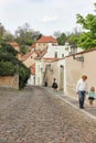 Old medieval narrow cobbled street and small ancient houses in Novy Svet, Hradcany district Royalty Free Stock Photo