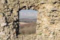 Old medieval ruined castle window with landscape view Royalty Free Stock Photo