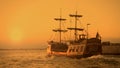 Old medieval ship gracefully sailing to open sea, travelling towards adventures