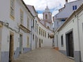 Old medieval street in Lagos with the Maria church in the Algarve Portugal Royalty Free Stock Photo