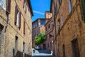 Old medieval street in middle of Siena, Italy. Royalty Free Stock Photo